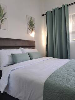Green room ensuite guesthouse Bellville South - contractor accommodation Cape Town near UWC with modern furnishings